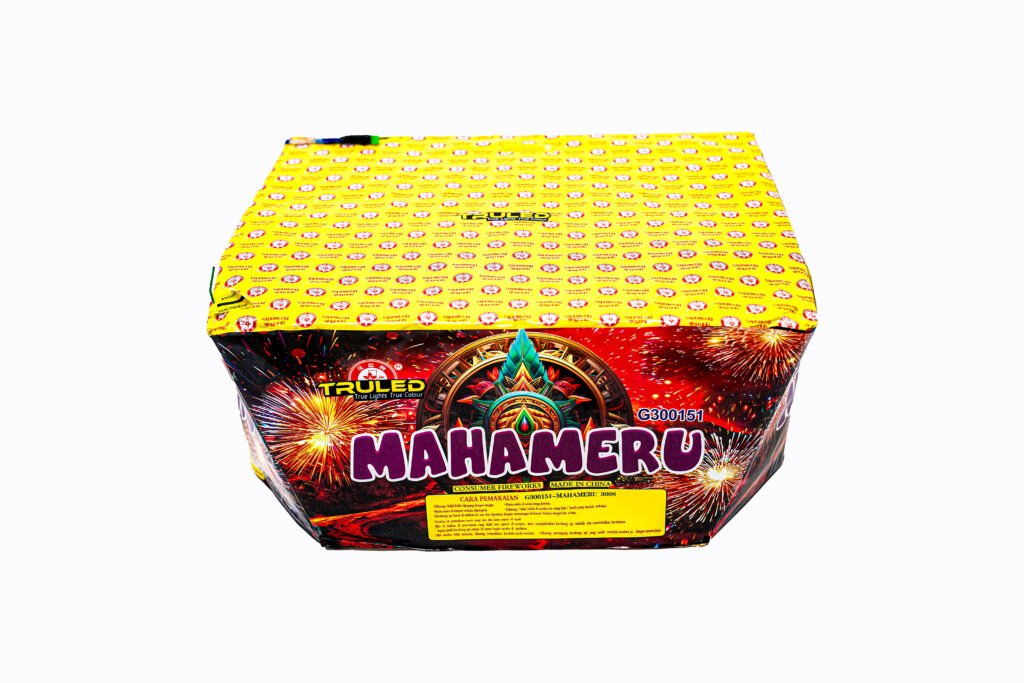 Colorful fireworks box with a bright yellow top and explosive graphic artwork on the sides, labeled Mahameru (consumer fireworks).