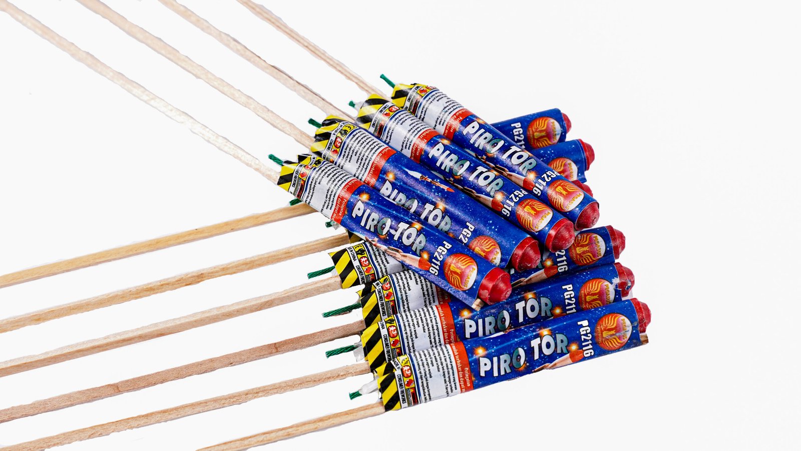 A cluster of blue and red firework tubes labeled 'PIRO TOP' arranged diagonally with wooden fuses extending outward.