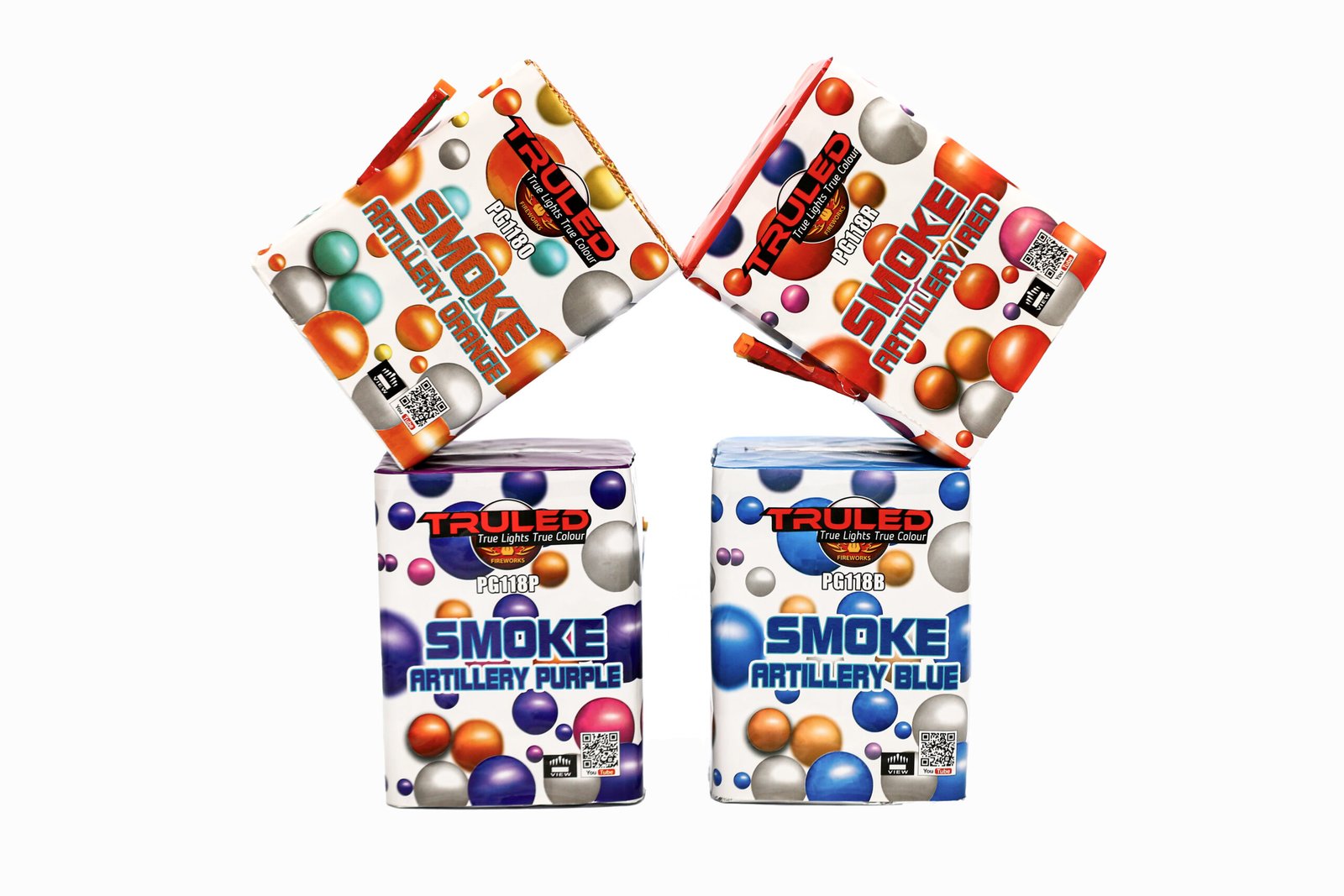 Two diagonally tilted firework boxes with colorful bubble patterns, labeled Smoke Artillery, resting on two base boxes forming an X shape.