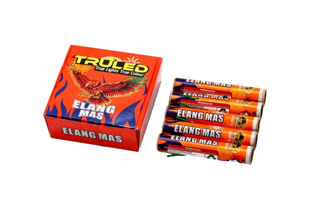 Red box of Elang Mas fireworks with four orange tubes beside it on a white background.