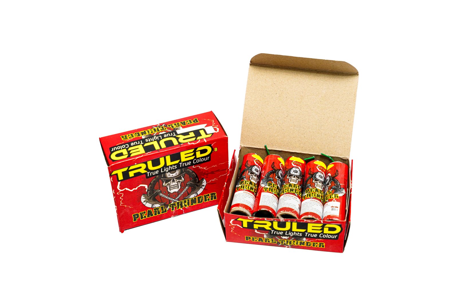 Open red Pearl Thunder fireworks box with multiple rocket tubes inside, labeled True Lights True Colour.