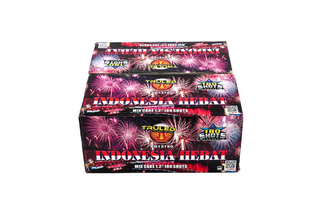 Box of fireworks with bright pink and purple fireworks graphics and bold 'Indonesia Hebat' branding, 180 shots label visible on the front.