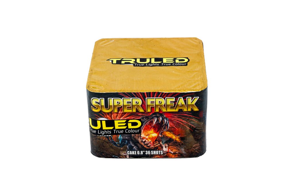 Box of fireworks cake with a gold top, featuring the bold 'SUPER FREAK' branding and fiery dragon artwork on the front panel.