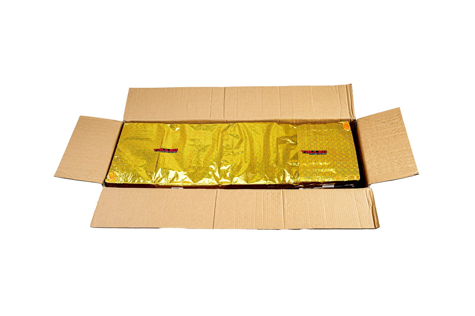 Open cardboard shipping box with gold-wrapped item inside, visible decorative pattern on foil