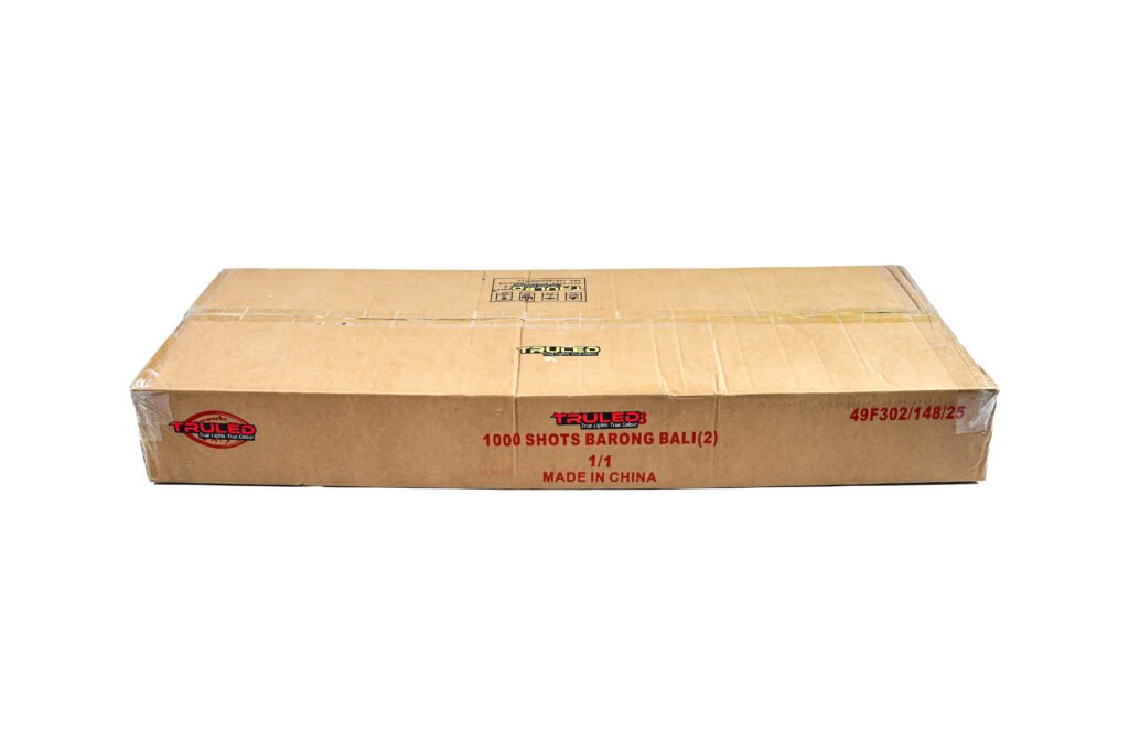 Cardboard shipping box with red and black branding reading '1000 SHOTS BARONG BALI (2)' and 'Made in China' visible on the front side.