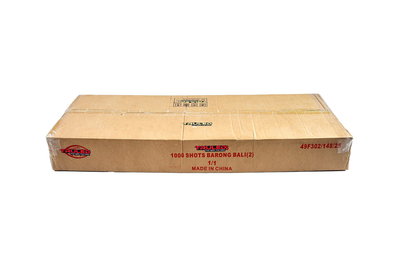 Cardboard shipping box with red and black branding reading '1000 SHOTS BARONG BALI (2)' and 'Made in China' visible on the front side.