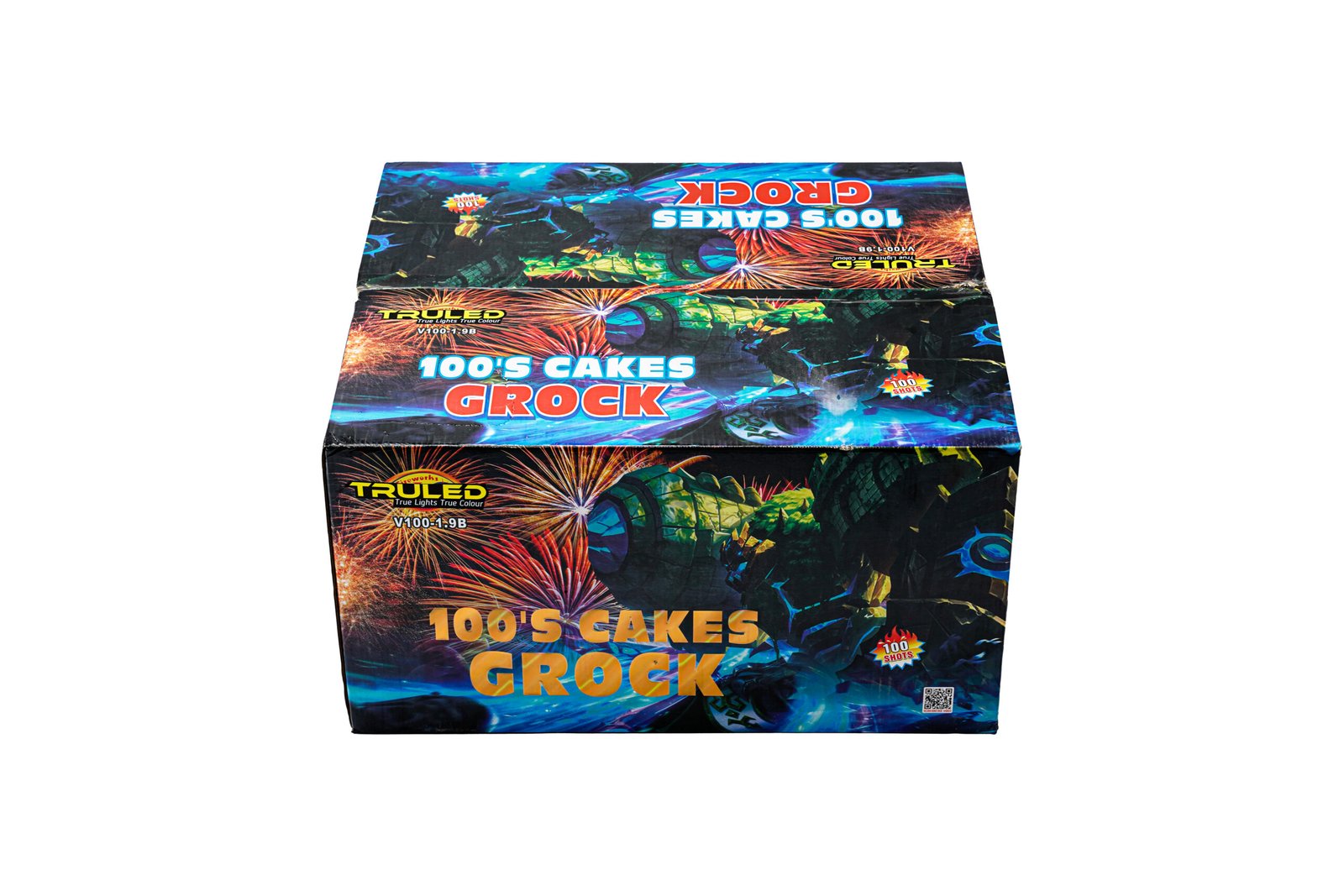 Two stacked colorful fireworks boxes covered in bright blue, red, and orange graphics with fireworks imagery on the packaging; visible text includes '100'S CAKES' and 'GROCK'.