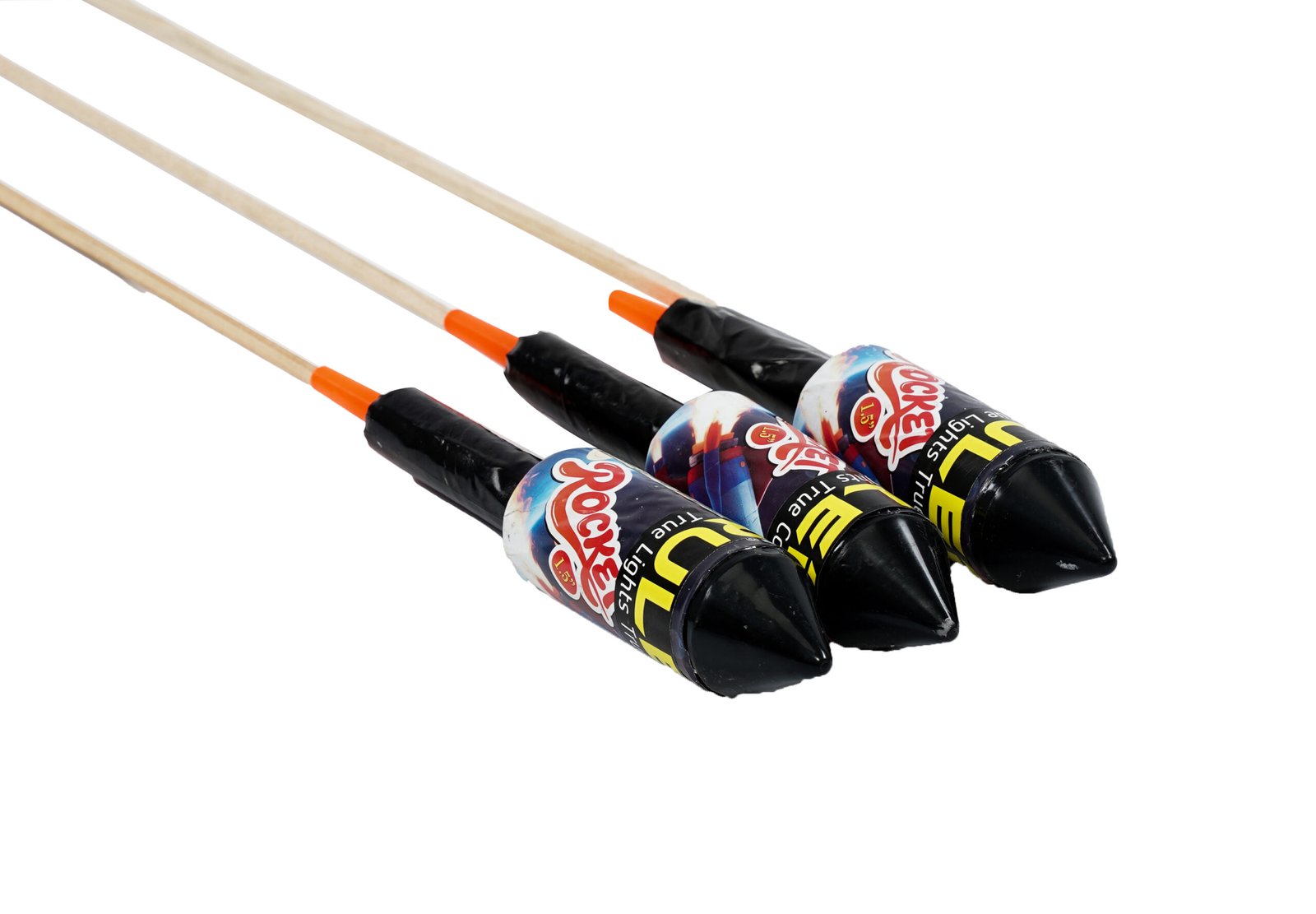 Three rocket fireworks with wooden sticks and orange tips, bundled together on a white background.