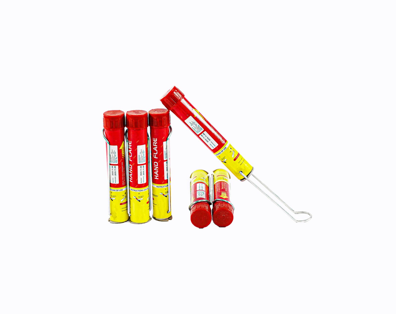 Several red and yellow fireworks tubes standing upright, with one tilted against a white background.