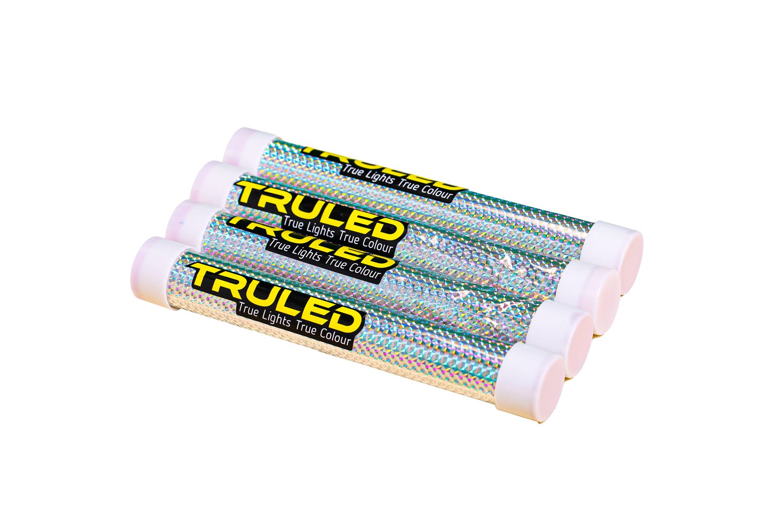 Diagonal row of iridescent pencils with pink eraser ends, their holographic wrappers reflecting rainbow colors and showing the text 'True Lights True Colour'.