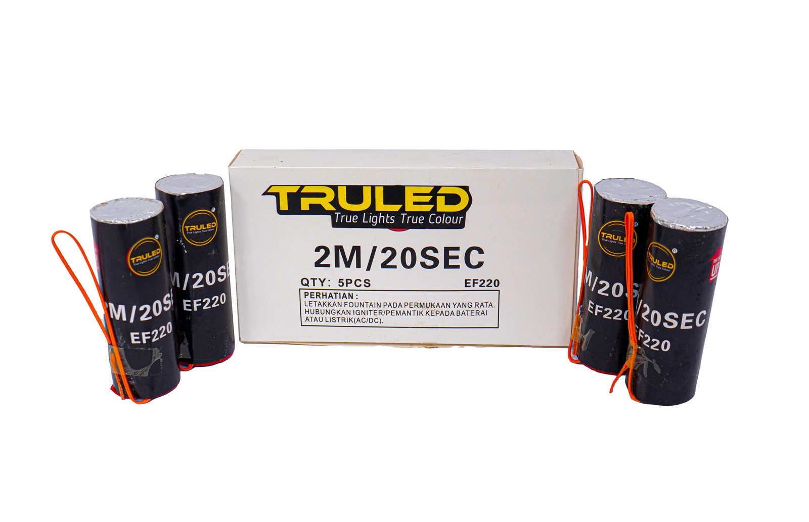 White Truled product box centered, flanked by black cylindrical units with orange wires (firework/igniter components).