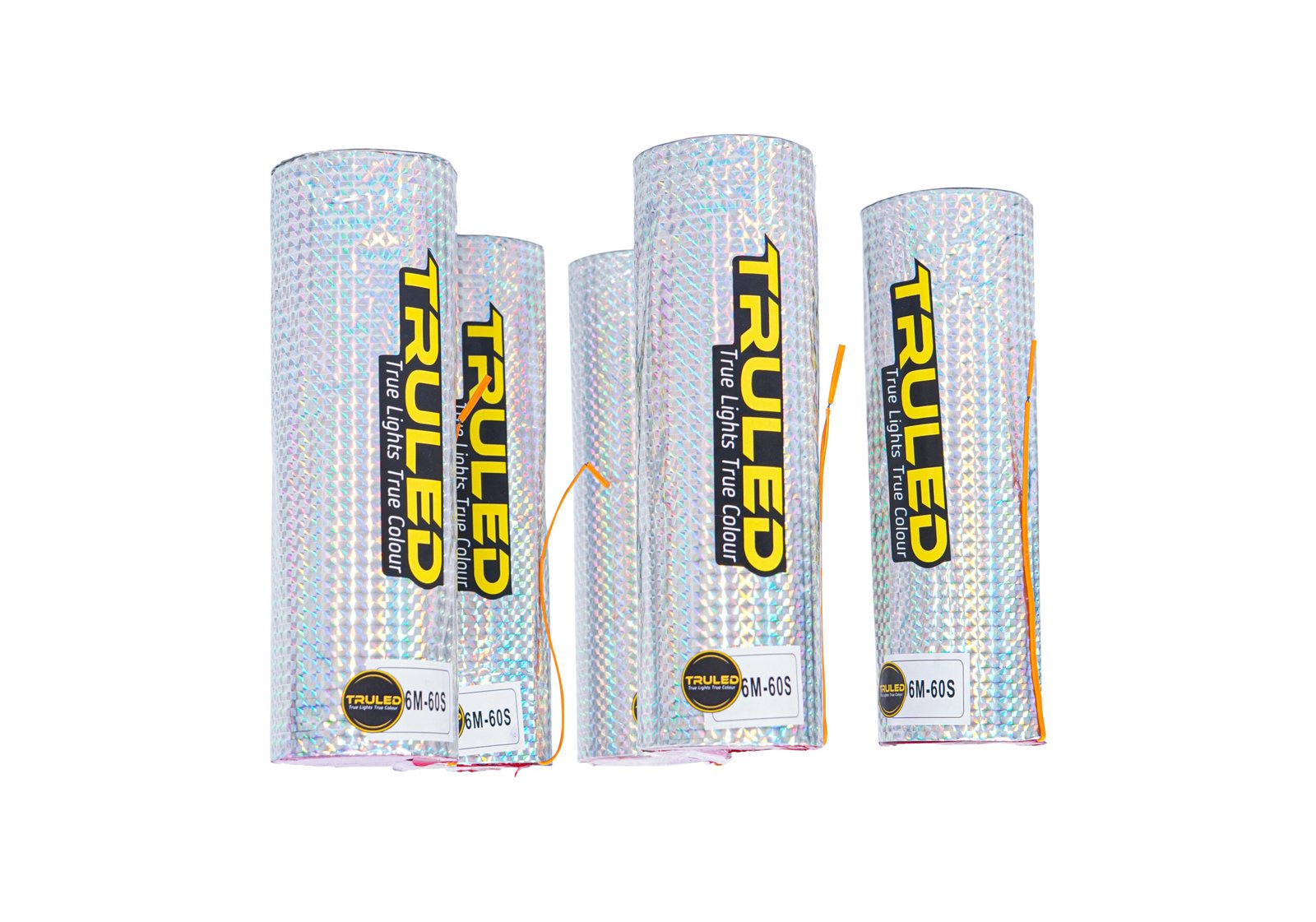 Three holographic, foil-wrapped cylinders standing upright in a row with yellow vertical branding and orange wiring visible in front.