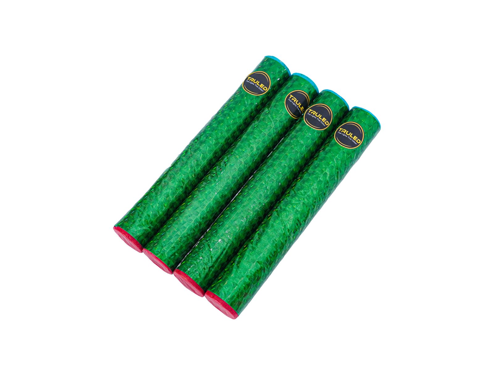 Four green foil-wrapped tubes with red ends arranged diagonally, with yellow circular labels on each tube (party favors).