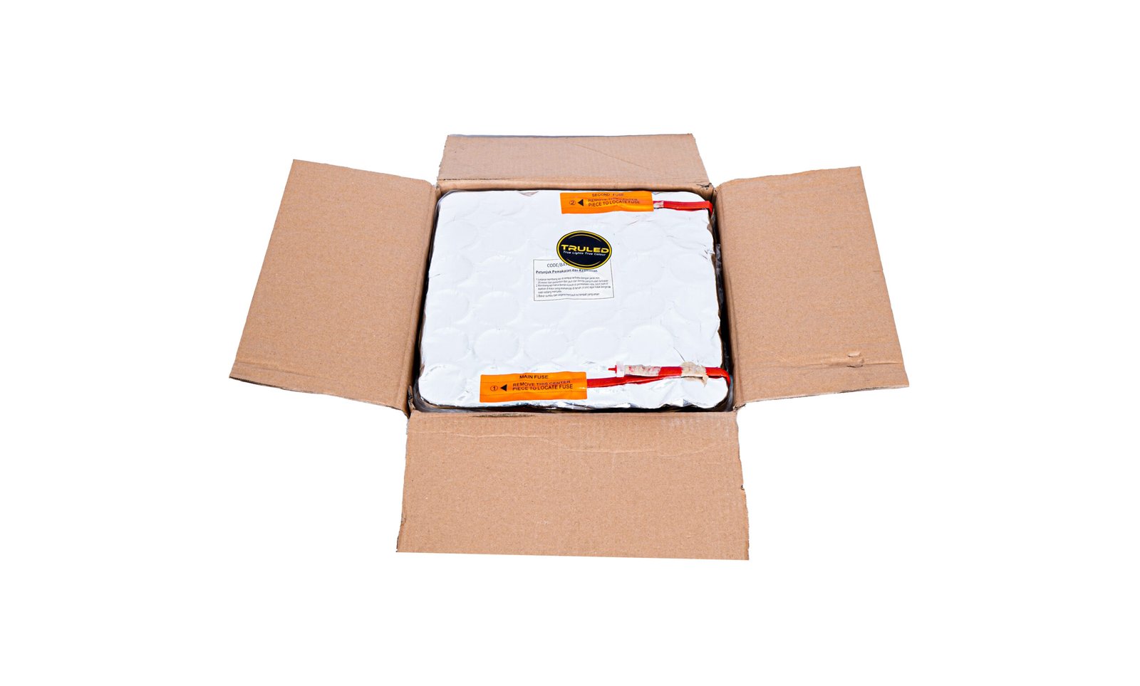 Opened cardboard box revealing a white insulated package with orange warning labels/tape inside